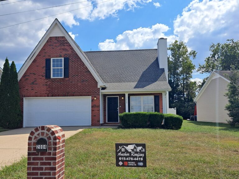 Simple red brick home with fantastic quality roofing in Franklin, TN - Anchor Roofing