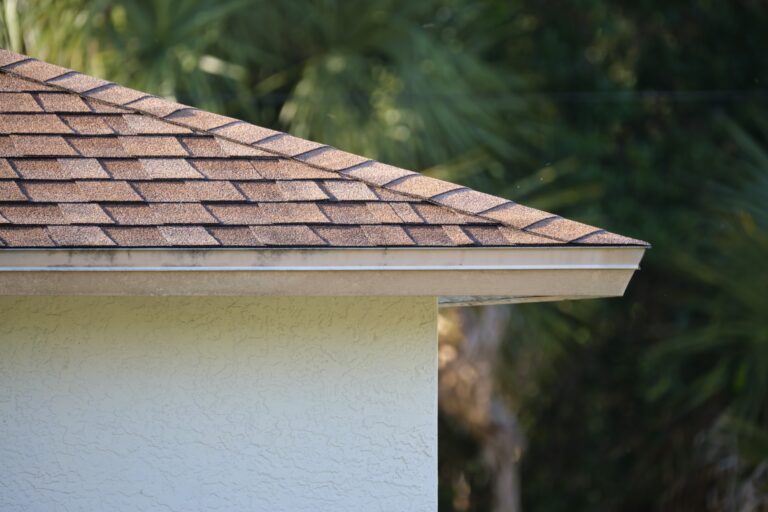 roofline corner closeup of house roof top covered with asphalt shingles 1920