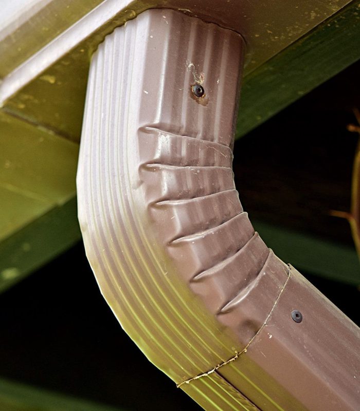An elbow connection between a rain spout and the down spout.