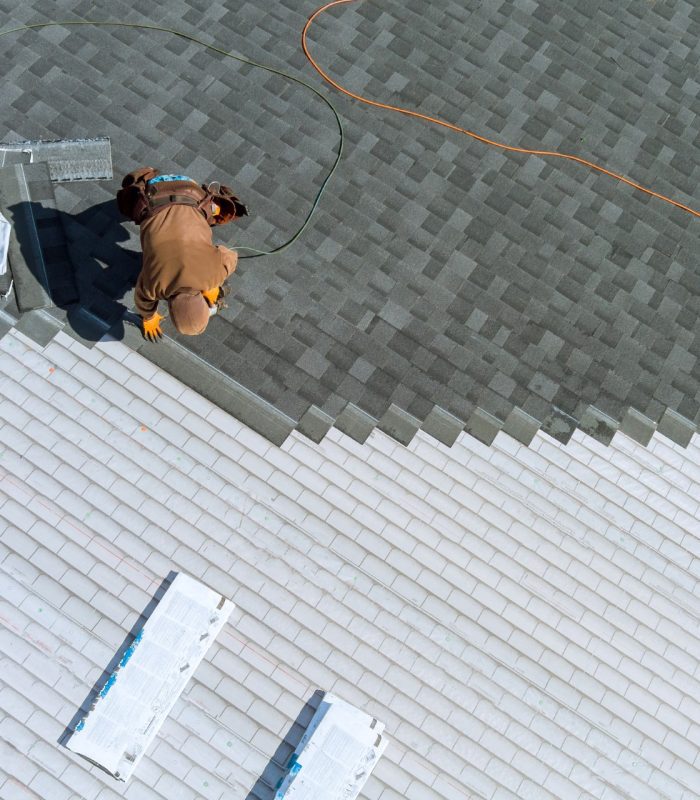 roof replacement repair installing shingles on the roof of a home 1920